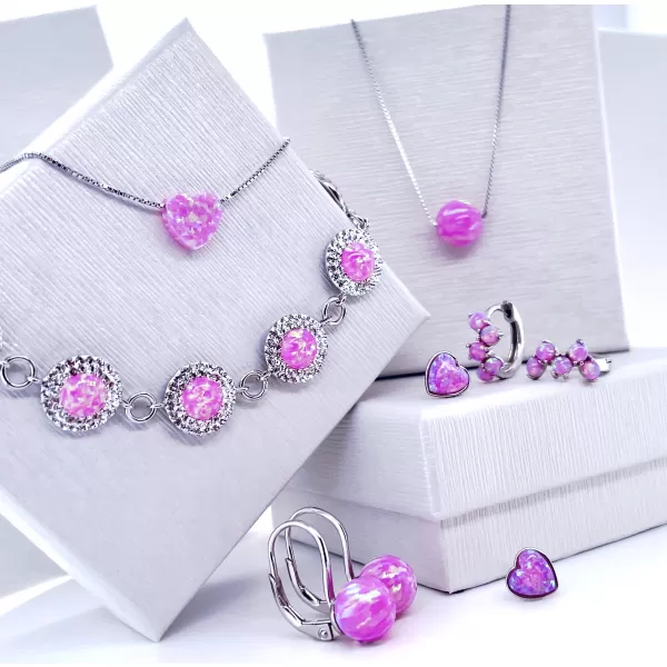 Strieborné náušnice kôstky so syntetickým opálom a Preciosa kryštály ružové okrúhle 31217.1 lt.rose