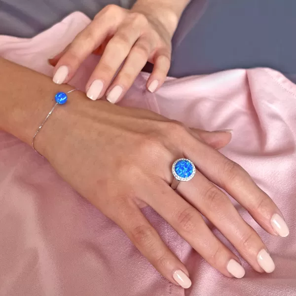 Strieborný prsteň so syntetickým opálom a kryštálmi Preciosa modrý 35060.1