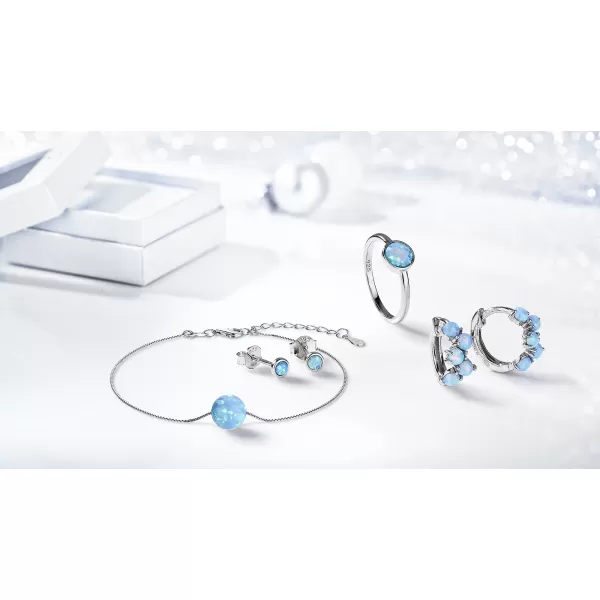 Strieborný prsteň so syntetickým opálom svetlo modrý okrúhly 15001.3