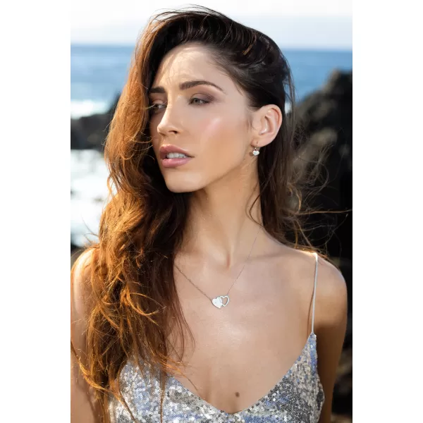 Strieborné náušnice visiace s kryštálmi Swarovski biele srdce 31125.1