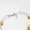Strieborný náramok so pozlátenými guličkami XKXC-4002-ES