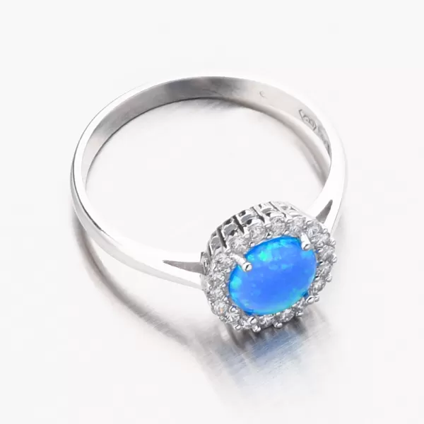 Biele zlato prsteň s modrým opálom a zirkónmi 11R-351
