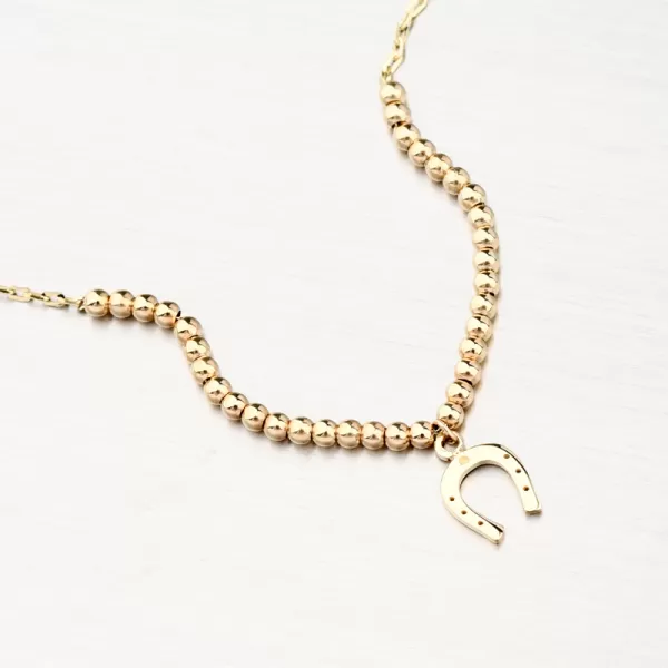 Zlatý náramok s guličkami a podkovou 144P-141240