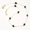 Zlatý náramok na nohu s čiernymi kryštálmi PKL14-025